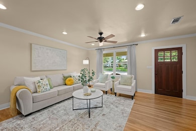 Living room featuring recessed lighting, baseboar