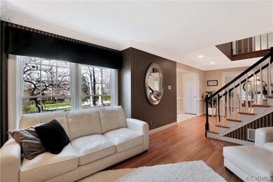 Another view of the living room showing hardwood f