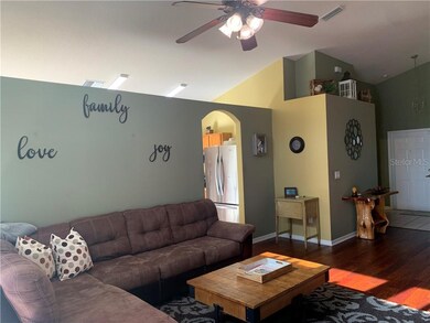 Living Room with entrance to Kitchen.