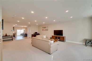 Spacious living room connects to the kitchen and d