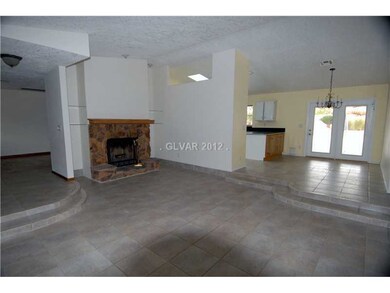 Den. spacious family room boasts wood burning fire