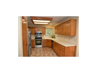 Pantry at left , and kitchen sink with views of ba