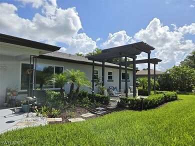 Back of property with a patio area, a pergola, and