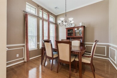 The formal Dining Room is also off the 2 Story Entryway and features Crown Moulding and Wainscoting.
