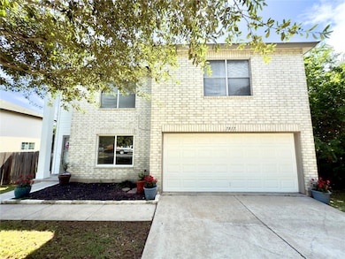 View of front of property with brick siding, driv