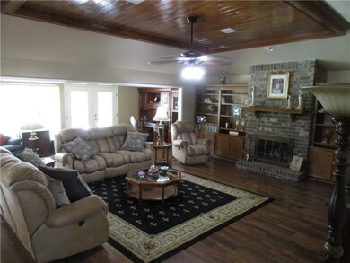 Open floor plan view of den and sun room