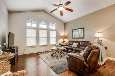 Living area with ceiling fan, hardwood / wood-sty