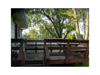 Deck. with view of fenced yard and Jefferson High 