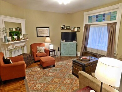The living room is in the front of the house just 