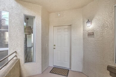 Doorway to property with stucco siding