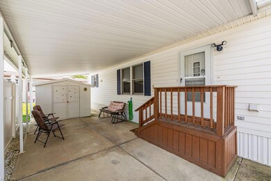 View of terrace featuring a shed