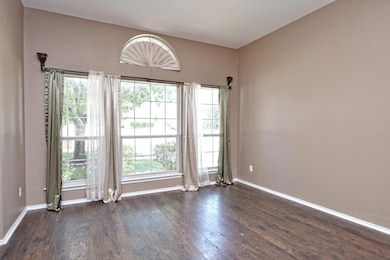 Unfurnished room featuring dark wood-type floorin