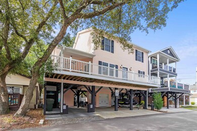 View of front facade with a carport