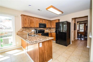 Kitchen with Granite countertops and ceramic tile 