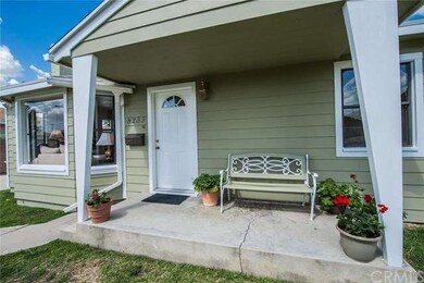 This quaint front sitting porch will remind you of