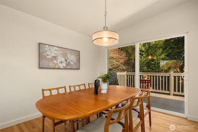 Vaulted ceilings with sliding doors to access backyard deck.