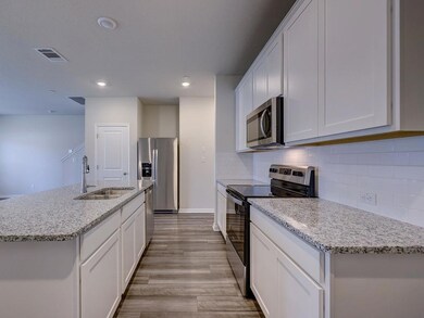 Kitchen with appliances with stainless steel fini