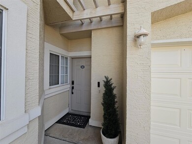 Doorway to property with a garage