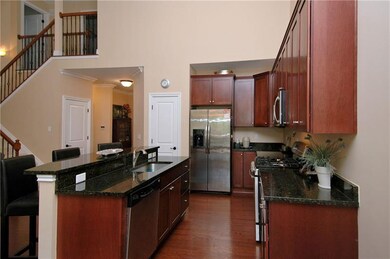 Kitchen - Hardwood floors, cherry cabinetry, grani