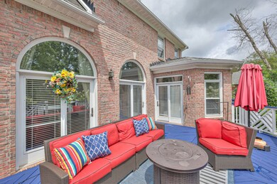 Two sets of French doors lead to the open living space, single side door leads to the kitchen.