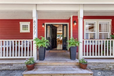 Welcome guests with timeless charm from the covered front porch, accented by craftsman details and potted blooms.