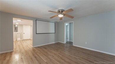Living room, bedrooms through walkway on right