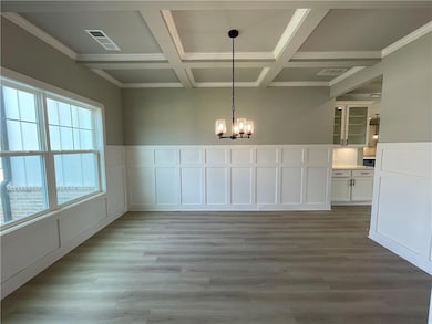 Unfurnished dining area featuring ornamental moldi