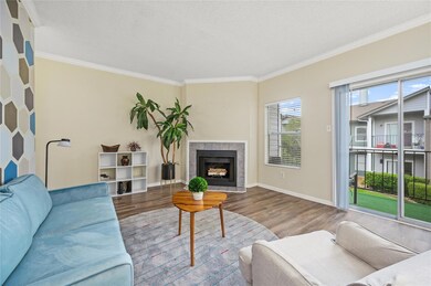 Living area with wood finished floors, ornamental