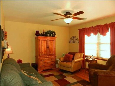Living Room has been painted in inviting Warm Colo