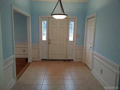 Foyer formal dining room to the right  kitchen/ gr