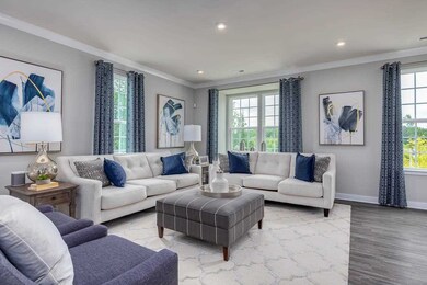 Notice the bay window behind the sofa.