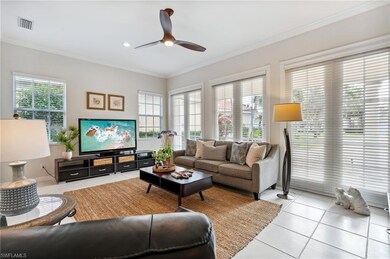 Living room with light tile patterned floors, ceil