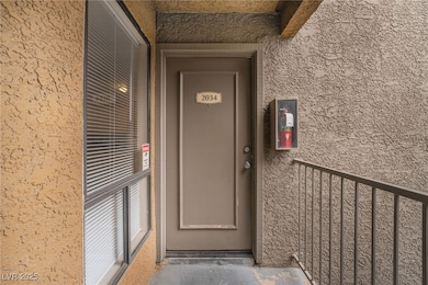 Property entrance with stucco siding