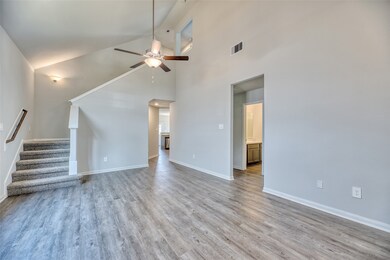 The gleaming vinyl plank flooring introduces a contemporary touch, offering both easy maintenance and durability, making it ideal for daily living and hosting gatherings.