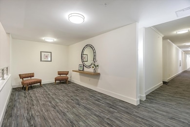 Welcoming hallway seating area just outside the unit.
