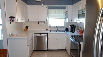 Clean and tidy kitchen with tile floors, Bosch dis