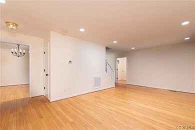 Empty room with light hardwood / wood-style floori