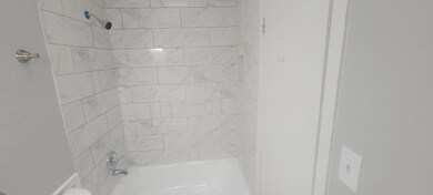 Bathroom with bathtub / shower combination
