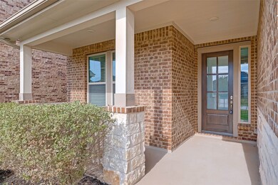 Stone and Brick elevation, Solid wood entry door with privacy glass