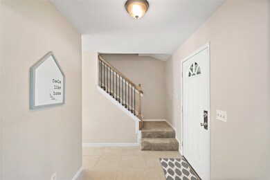 Entry with ceramic tile.