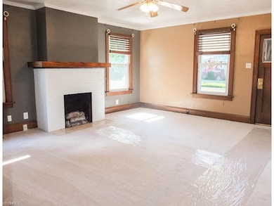 Living room with a gas fireplace and brand new car