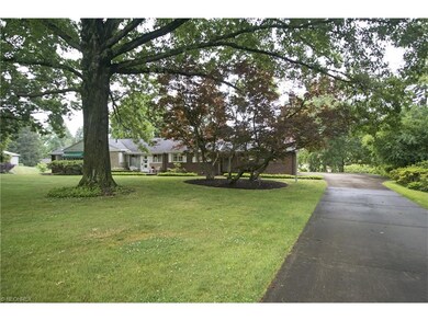 The wonderful lot boasts mature trees and landscap