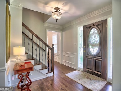 View of stairway and front door