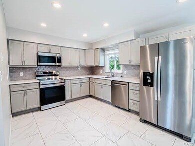 Beautifully updated kitchen with ceramic tile, new
