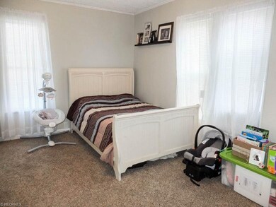 Bedroom 2 with crown molding.