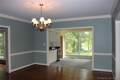 Dining Room opens to Sun Room.