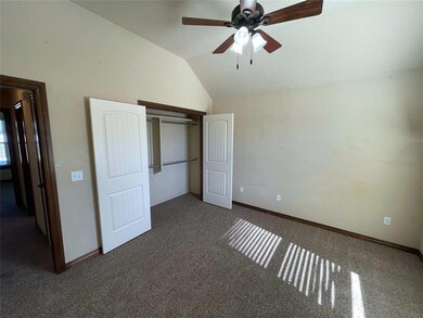 Unfurnished bedroom with ceiling fan, a closet, va