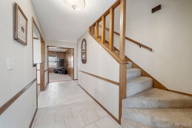 Enter here at this welcoming foyer...stairway to s