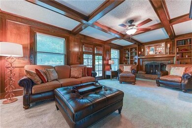 Gorgeous library paneling, box-beam ceiling, and b
