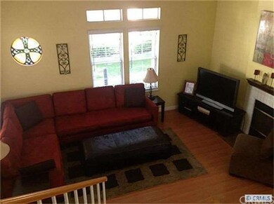 VIEW OF LIVING ROOM WITH HIGH BEAM CEILINGS